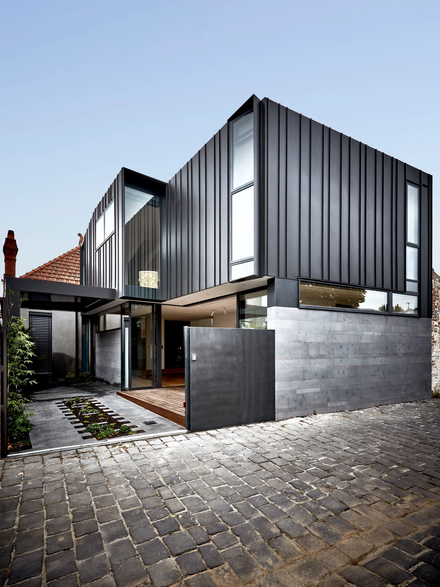 Albert Park, finished dark metal-clad addition viewed from the laneway